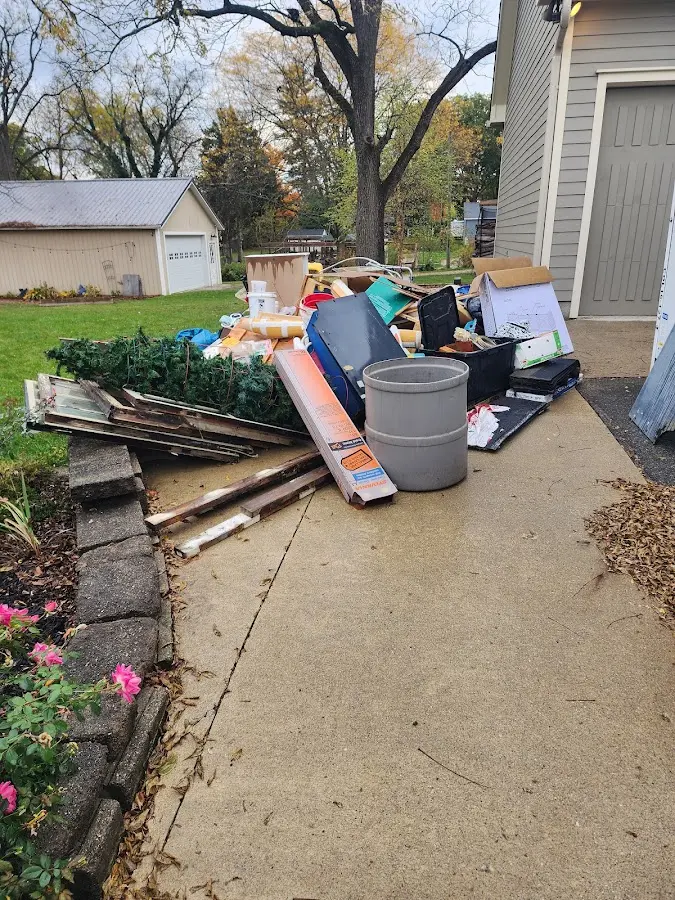 Dumpster being loaded with debris for Residential Dumpster Rental in Calabash
